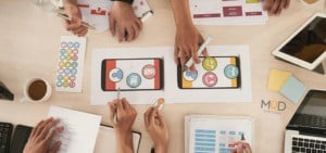 group of social media marketers working together at a table