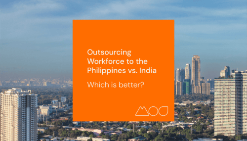 A vivid orange square displays the text: Outsourcing to the Philippines vs. India: Which is better? set against a cityscape of towering buildings under a clear blue sky and a far-off urban skyline.